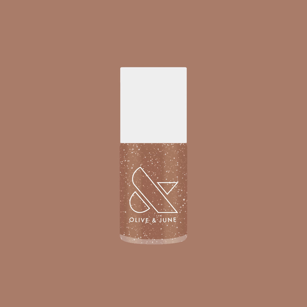 Olive and June bottle of Coconut Shimmer Gloss gel polish with warm chestnut base and silver shimmer on brown background