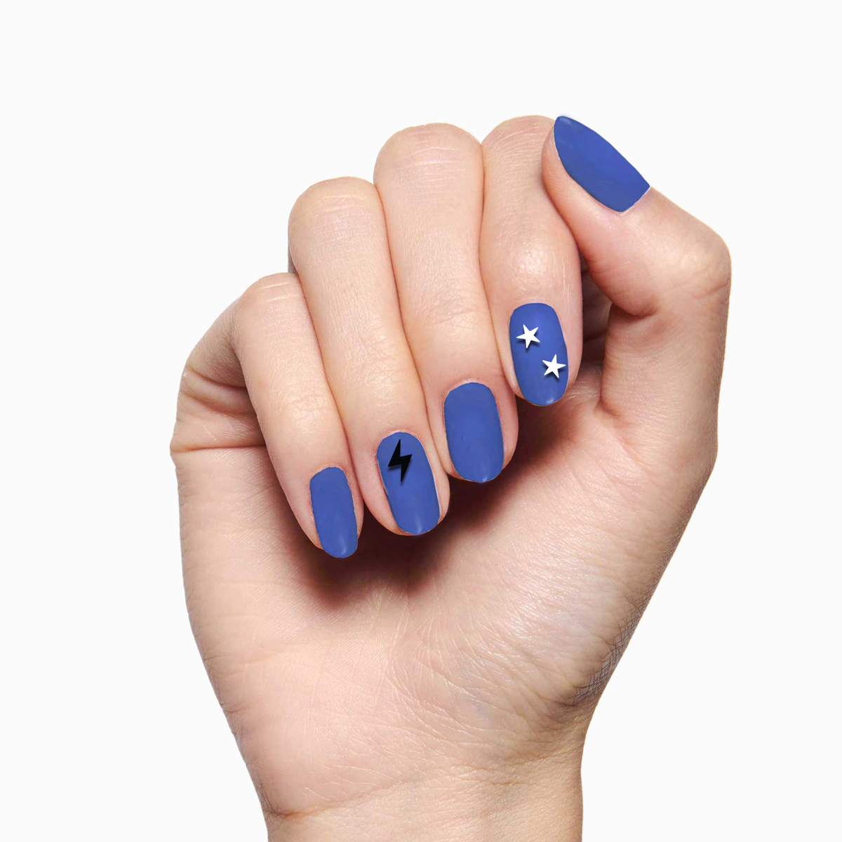 Hand with blue matte manicure featuring EYE LOVE YOUR MANI nail art stickers of stars and lightning bolt designs